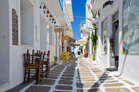 Street with traditional architecture and some small shops in the old part of Naousa village on Paros island, Greeceのeditorial素材