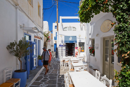 Street with traditional architecture and some small shops in the old part of Naousa village on Paros island, Greeceのeditorial素材