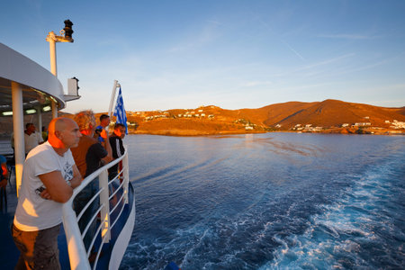 People on the deck of a ferry leaving Kythnos island in Cyclades, Greeceのeditorial素材