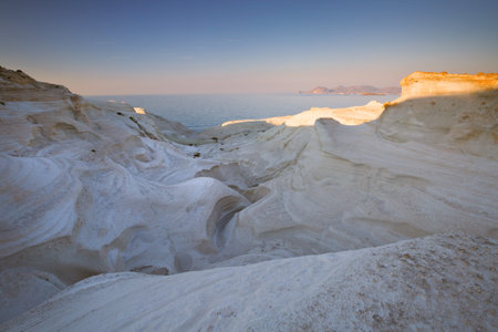 Coastal scenery with white volcanic rocks near Sarakiniko beach in Milos island, Greece.の写真素材