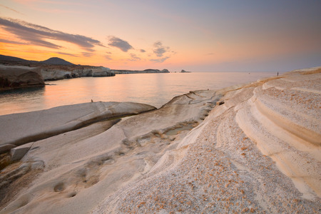 Coastal scenery with pale volcanic rocks near Sarakiniko beach in Milos island, Greece.の写真素材