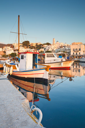Fishing boats in Adamantas harbour on early morningのeditorial素材