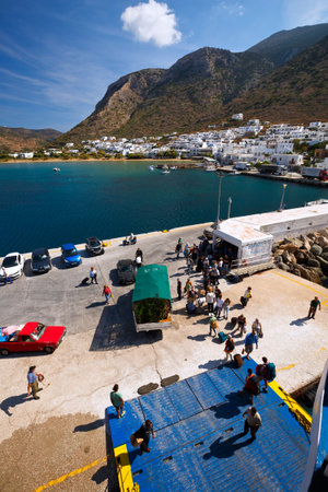 Lorry and passengers getting aboard a ferry in the port of Kamares village in Sifnos island, Greeceのeditorial素材