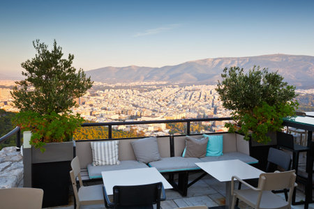 Coffee shop on the top of Lycabettus Hill and view of Athens, Greece