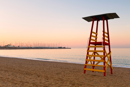 Lifeguard tower on a beach in Palaio Faliro and dry dock of Alimos marina in Athens, Greece.の写真素材