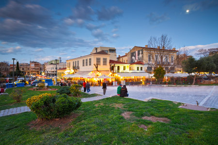 Tourists in a street near ancient Agora with many restaurants and coffee shops, Athens.のeditorial素材