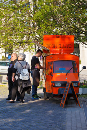 Customers waiting for their coffee at a mobile coffee shop in Bratislava.のeditorial素材