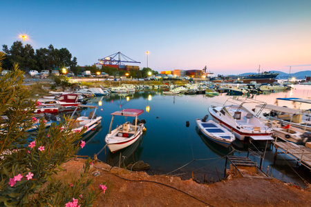 Small harbour with fishing boats and motor boats between terminal 3 of the container port and shipyards of Perama.のeditorial素材