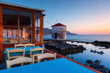 Sunrise landscape with a windmill in Agia Marina village on Leros island in Greece.のeditorial素材