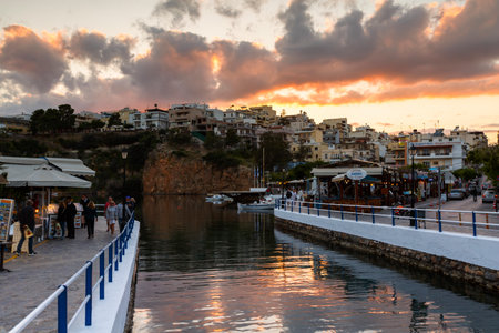 Evening view of Agios Nikolaos and its harbor, Crete, Greece.のeditorial素材