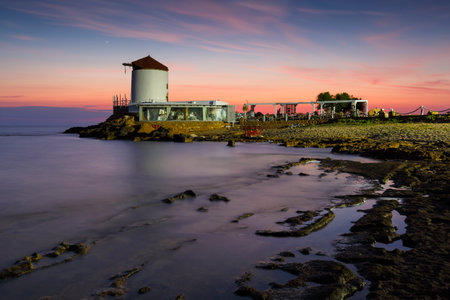 Restaurant in an old windmill on the coast near Molos village on Skyros island, Greece.のeditorial素材
