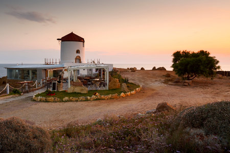 Restaurant in an old windmill on the coast near Molos village on Skyros island, Greece.のeditorial素材