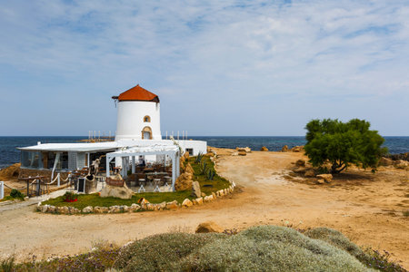 Restaurant in an old windmill on the coast near Molos village on Skyros island, Greece.のeditorial素材