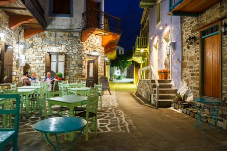 Main street with coffee shops in Chora of Alonissos island, Greece.のeditorial素材