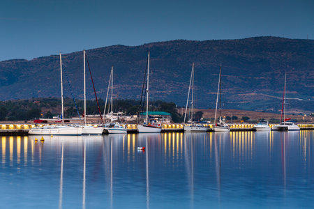 Sail boats in the harbour of Volos city as seen early in the morning.のeditorial素材