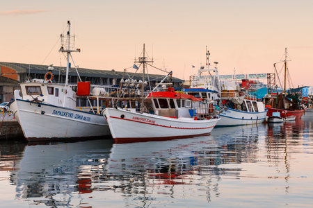 Fishing boats in the port of Volos city as seen early in the morning.のeditorial素材