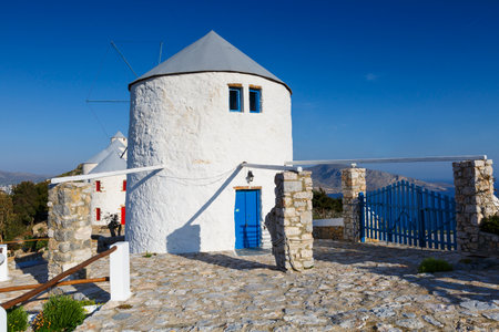 Rebuilt traditional windmills on a hill above Panteli village on Leros island, Greece.のeditorial素材