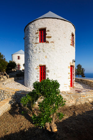 Rebuilt traditional windmills on a hill above Panteli village on Leros island, Greece.のeditorial素材