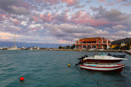 Colorful sunset sky over Zakynthos harbour, Greece.
