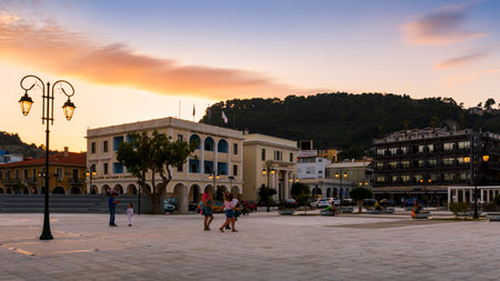 People in front of the town hall in Solomos square in Zakynthos town, Greece.のeditorial素材