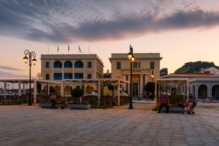People in front of the townhall in Solomos square in Zakynthos town, Greece.のeditorial素材