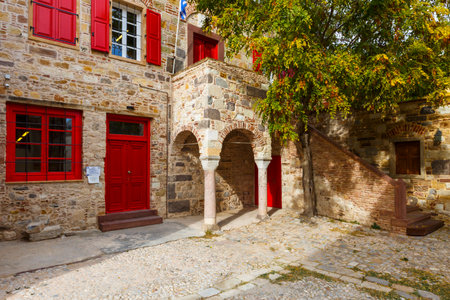 Architecture in the old town of Chios with red doors and windows.のeditorial素材