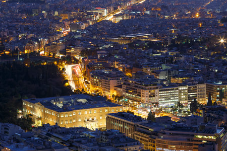 View of parliament and city of Athens from Lycabettus hill at sunset, Greece.のeditorial素材