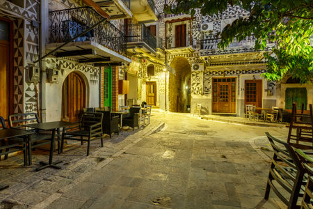 Coffee shops in the main square of Pyrgi village on Chios island, Greece.のeditorial素材