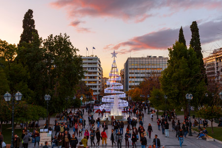 People in Syntagma square with a large Christmas tree it its center, Athens, Greece.のeditorial素材