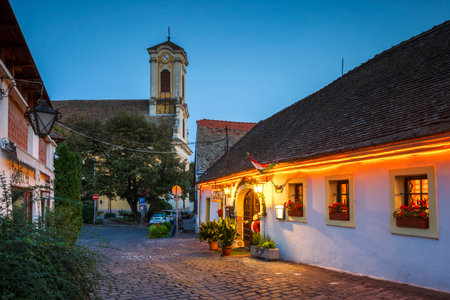 Szentendre, Hungary - August 17, 2018: Restaurant and a church in the old town of Szentendre in Hungary.のeditorial素材