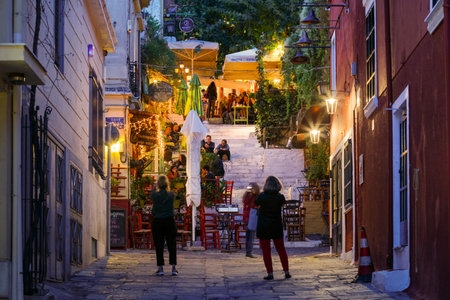 Athens, Greece - September 28, 2018: People in a coffee shop in a street of Plaka neighbourhood in Athens, Greece.のeditorial素材