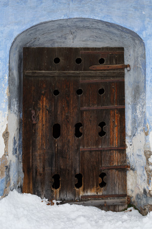 Carved wooden door of a traditional granary in Bela-Dulice village, northern Slovakia.の写真素材