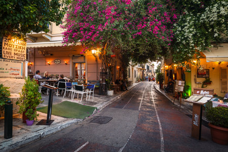 Athens, Greece - October 31, 2018: Coffee shops and restaurants in the old town of Athens just under Acropolis.のeditorial素材