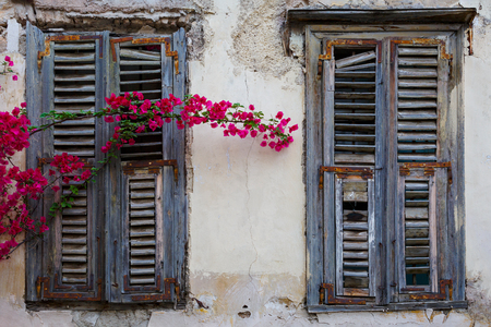 Windows of an old abandoned building in the old town of Athens, Greece.の写真素材