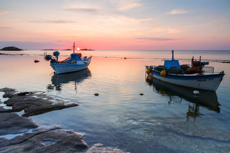 Molos, Greece - June 17, 2017: Fishing boats in a natural harbour near Molos village on Skyros island, Greece.のeditorial素材
