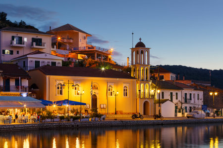 Vathy, Greece - October 3, 2017: Evening view of the church in Vathy harbur on Meganisi island, Greece.のeditorial素材