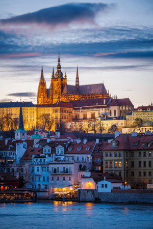 Prague, Czech Republic - March 08, 2019: Evening view of Prague Castle over river Vltava.のeditorial素材