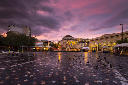 Athens, Greece - November 29, 2019: Early morning view of Acropolis, old mosque and metro station in Monastiraki square.のeditorial素材