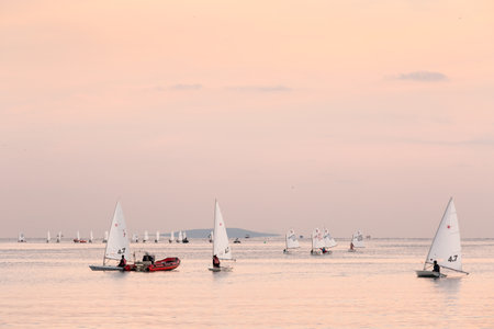 Athens, Greece - December 6, 2019: Sail boats of the sailing school in the Saronic gulf near Piraeus, Athens.のeditorial素材