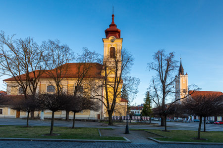 Rimavska Sobota, Slovakia - March 3, 2019: Classicistic Roman Catholic and Calvinist churches in the town of Rimavska Sobota, Slovakia.のeditorial素材