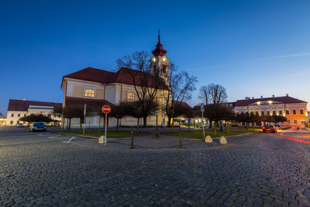 Rimavska Sobota, Slovakia - March 3, 2019: Classicistic Roman Catholic church in the town of Rimavska Sobota, Slovakia.のeditorial素材