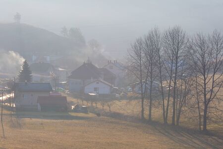 Village in a morning mist in Turiec region, Slovakia.の写真素材