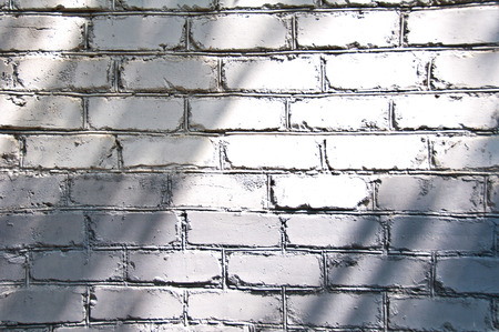 Grey brick background wall in day lightの写真素材
