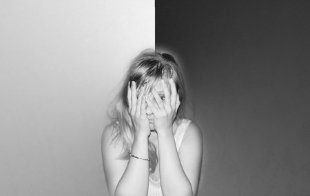 Tired young blond woman black and white sepia styleの写真素材