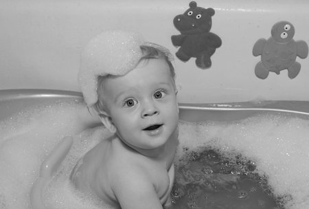 Baby boy in bath sepia filter