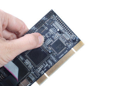 Hand holds board chip isolated whiteのeditorial素材