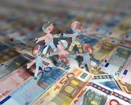 little euro acrobat figures standing on euro currencyの写真素材