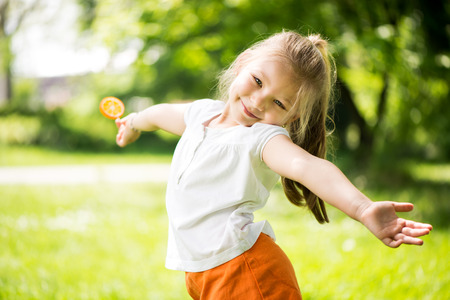 Cute Little Girl having fun in The Park.の写真素材