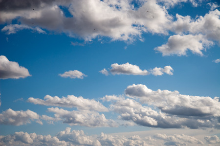 Beautiful fluffy clouds in the blue sky background.の写真素材