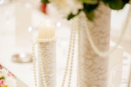 Close-up of a wedding table decoration with candleの写真素材